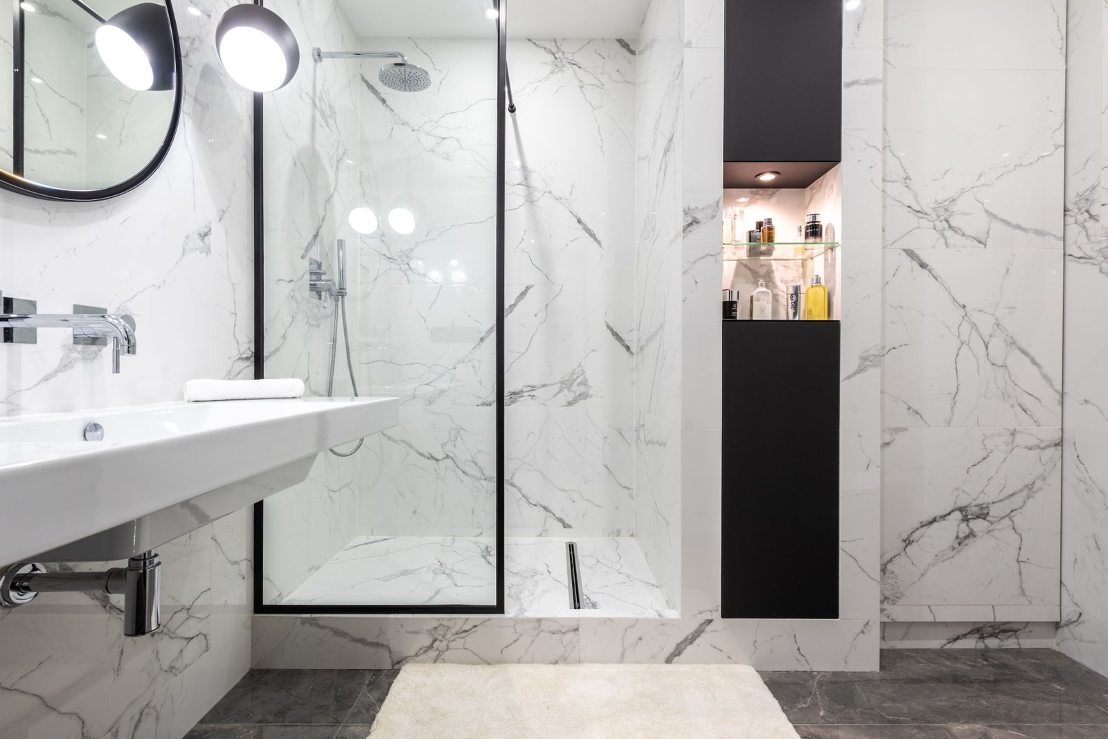 A modern renovated bathroom with a tiled walk-in shower